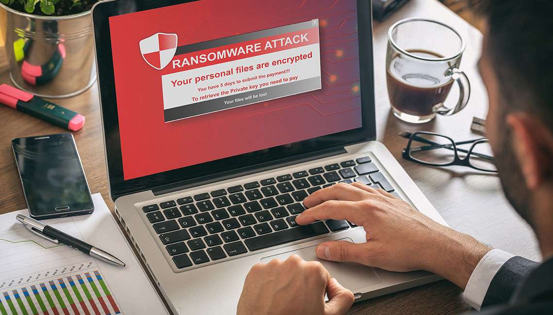 Ransomware attack alert on laptop screen