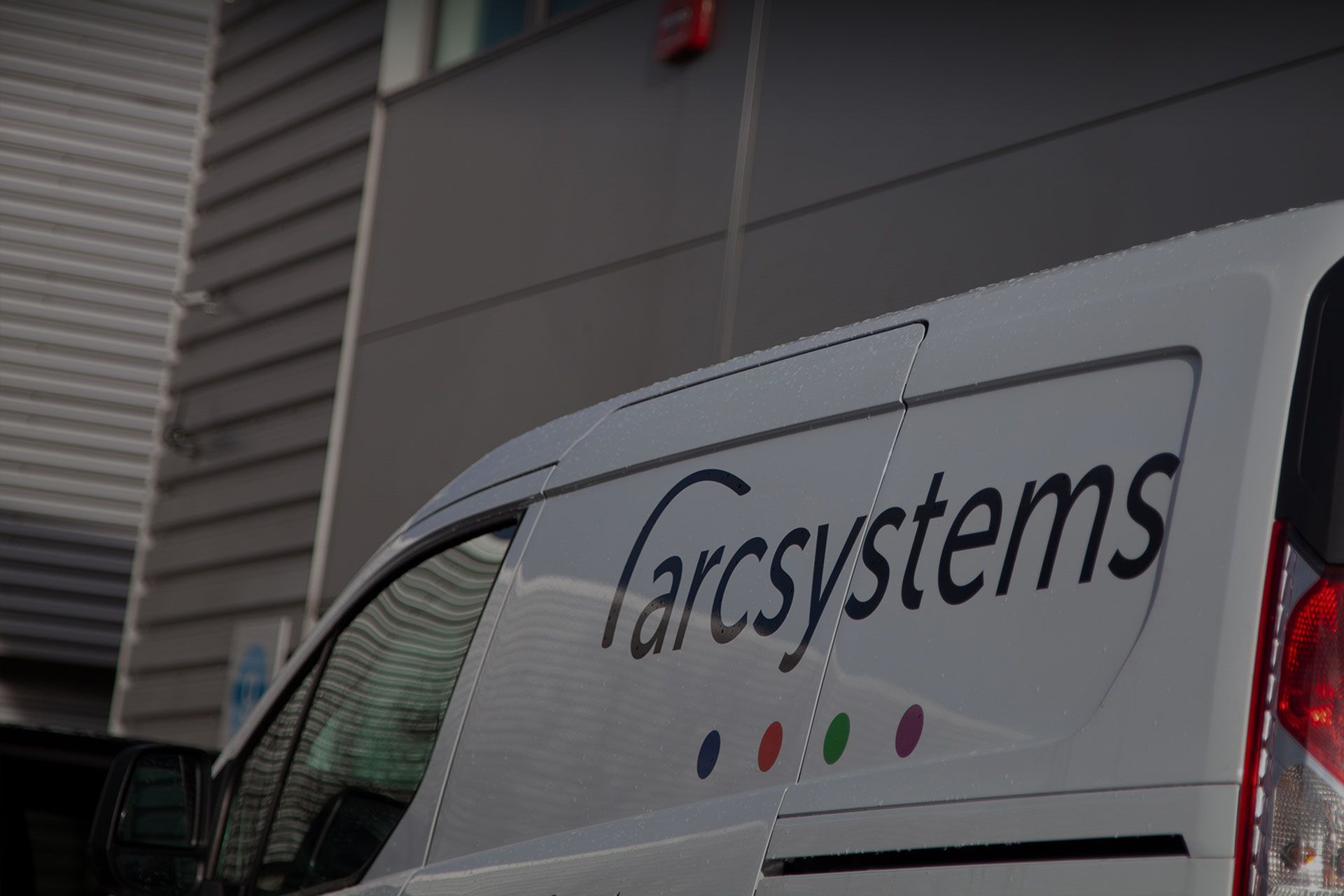 white van with arc systems logo