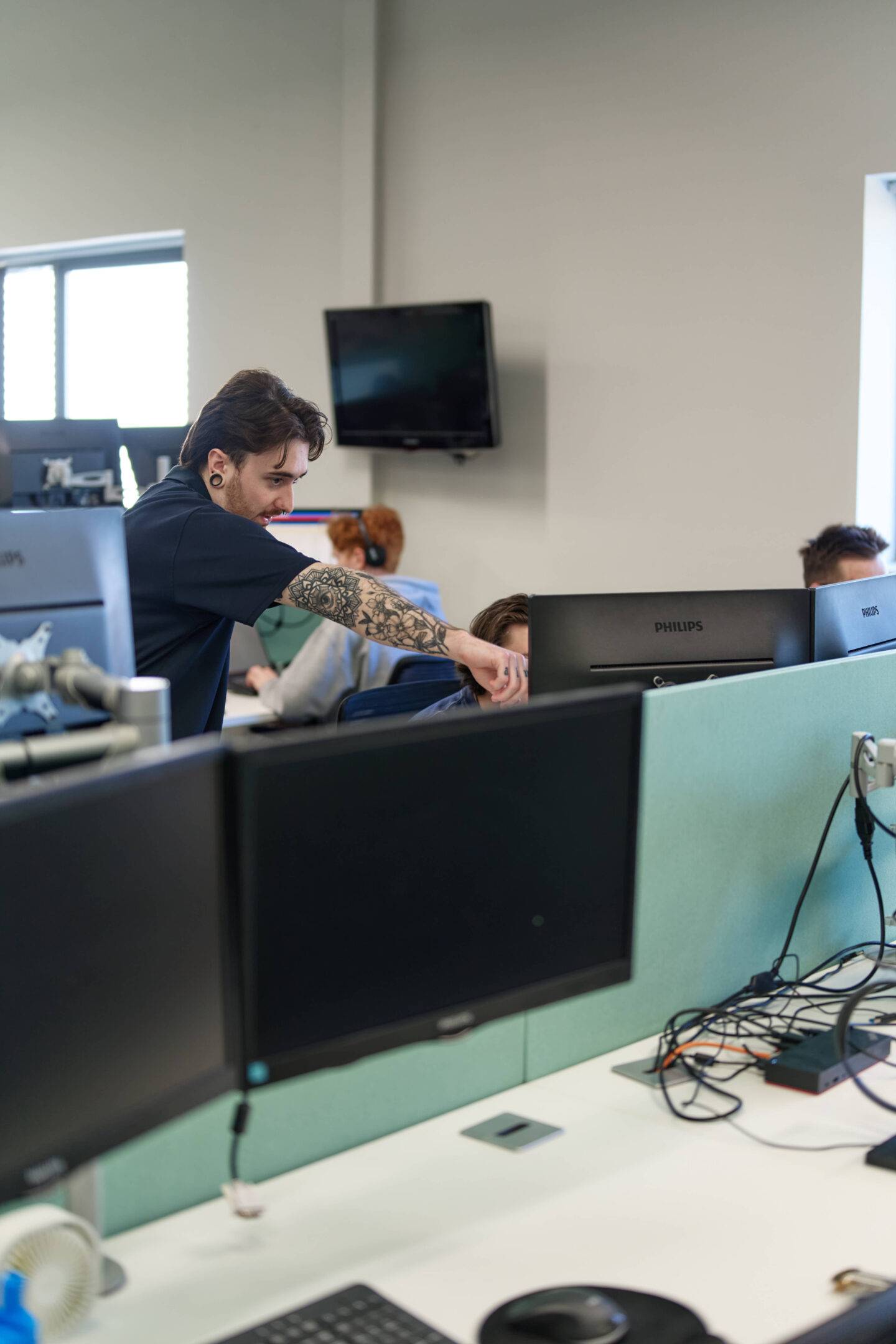 man pointing at laptop