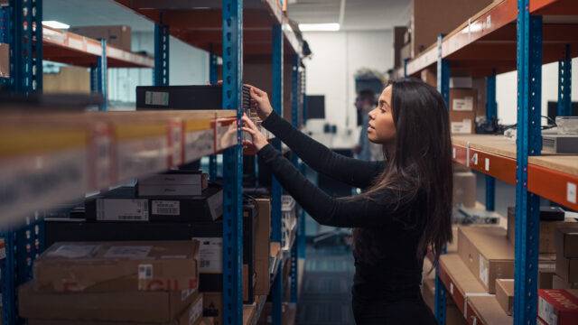 Girl reaching on shelf