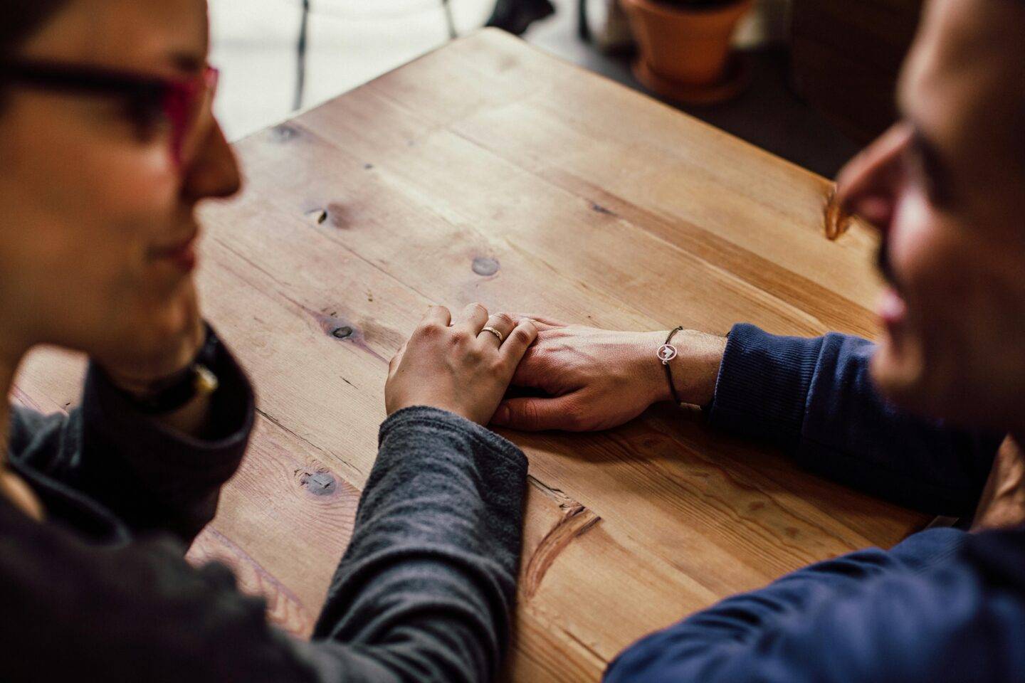Two people holding hands