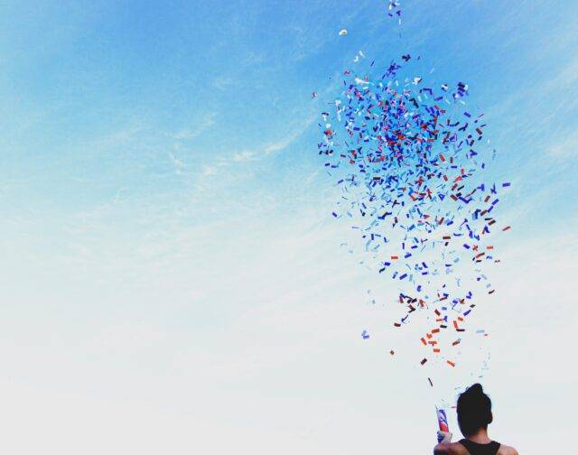 Person celebrating with confetti cannon