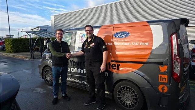 James from Arc and Mike from Every Child Online shake hands