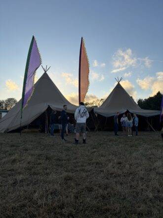 People standing outside a tent