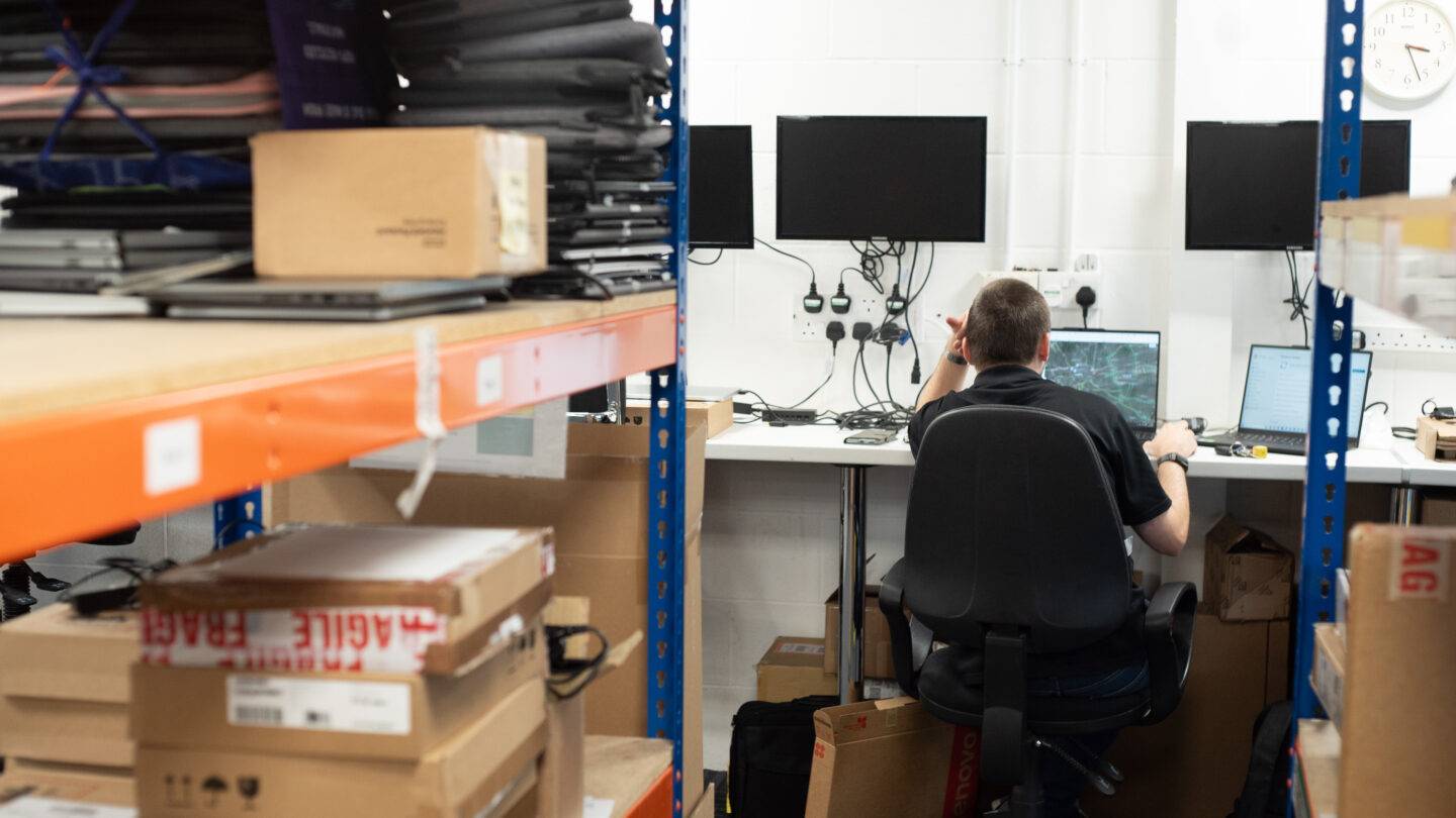Man working at computer in storage room